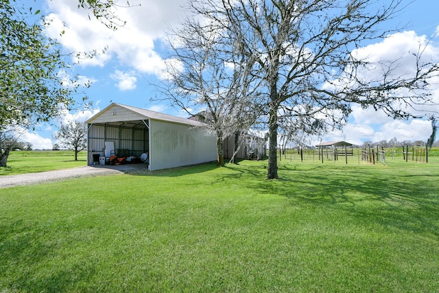 540 Chisolm Trl, Simonton, TX 77476 - view of yard featuring a pole building, an outdoor structure, a detached carport, and gravel driveway