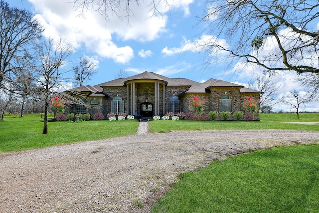 540 Chisolm Trl, Simonton, TX 77476 - view of front facade with a front lawn, stone siding, and gravel driveway