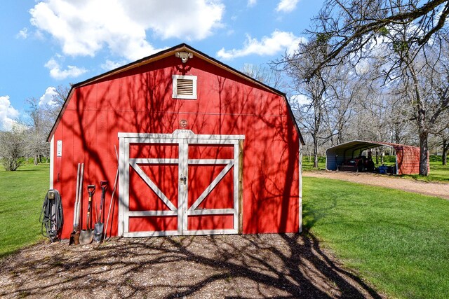 540 Chisolm Trl, Simonton, TX 77476 - view of barn featuring a lawn, a carport, and dirt driveway