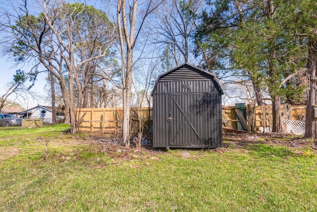 view of shed featuring a fenced backyard