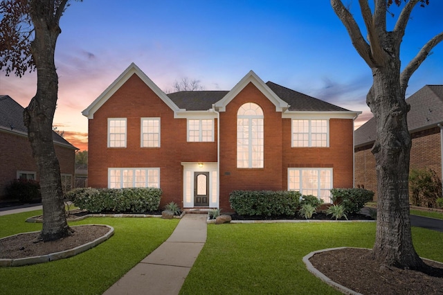 4103 Waterstone Dr, Missouri City, TX 77459 - colonial-style house with a yard and brick siding