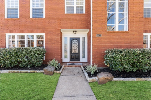 4103 Waterstone Dr, Missouri City, TX 77459 - view of exterior entry with a yard and brick siding