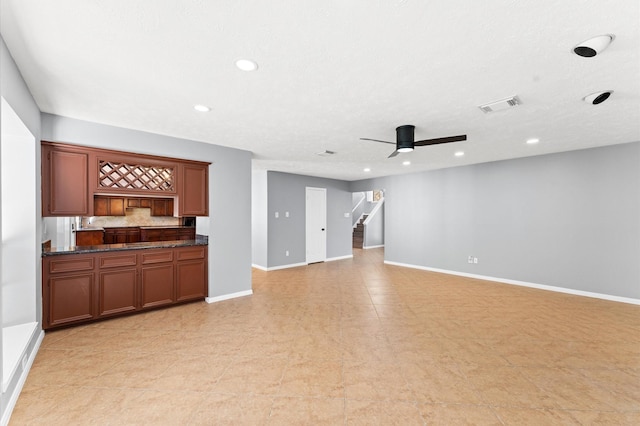 4103 Waterstone Dr, Missouri City, TX 77459 - unfurnished living room with ceiling fan, visible vents, stairway, baseboards, and recessed lighting