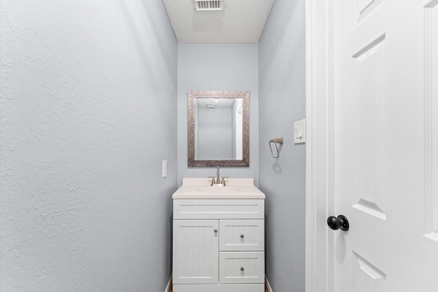 4103 Waterstone Dr, Missouri City, TX 77459 - bathroom featuring vanity, a textured wall, and visible vents