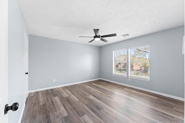 4103 Waterstone Dr, Missouri City, TX 77459 - unfurnished room with visible vents, a ceiling fan, baseboards, and wood finished floors