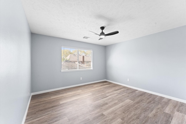 4103 Waterstone Dr, Missouri City, TX 77459 - unfurnished room with baseboards, a ceiling fan, wood finished floors, and visible vents