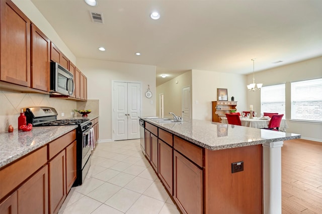 7908 Beryl Ct, Texas City, TX 77591 - kitchen featuring visible vents, a sink, baseboards, and appliances with stainless steel finishes