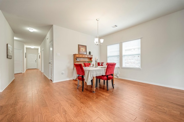 7908 Beryl Ct, Texas City, TX 77591 - dining space with visible vents, baseboards, a chandelier, and light wood-type flooring