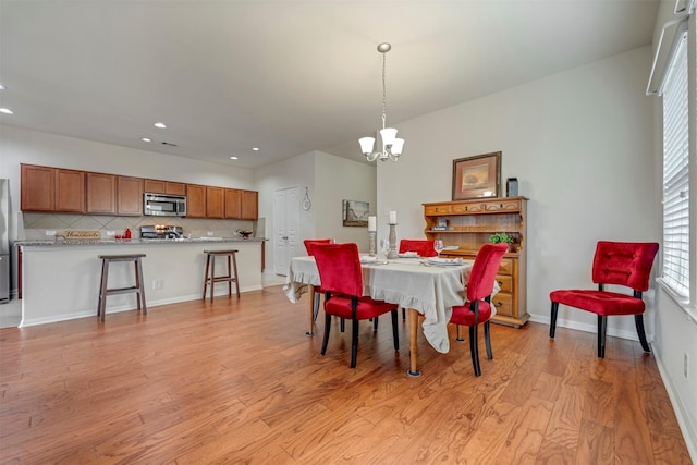7908 Beryl Ct, Texas City, TX 77591 - dining area with recessed lighting, baseboards, light wood finished floors, and a chandelier