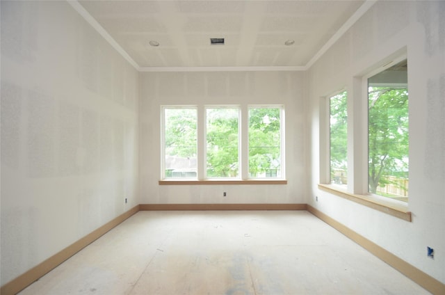 spare room with baseboards and visible vents