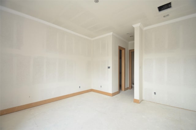 spare room featuring baseboards and ornamental molding