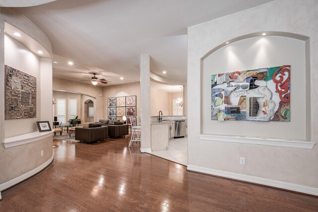 foyer featuring recessed lighting, a ceiling fan, arched walkways, and wood finished floors