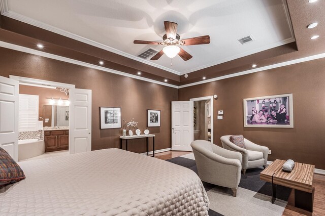 bedroom featuring crown molding, recessed lighting, visible vents, and a raised ceiling