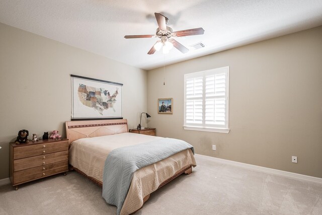 bedroom featuring visible vents, baseboards, and carpet floors