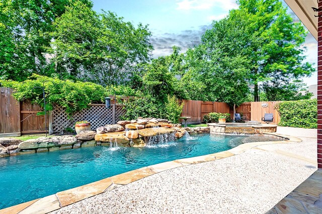view of swimming pool with a fenced backyard, a fenced in pool, and a patio