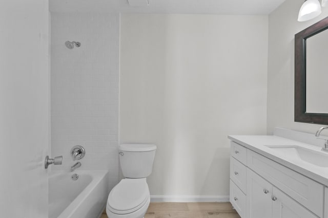 full bathroom featuring vanity, baseboards, toilet, and  shower combination