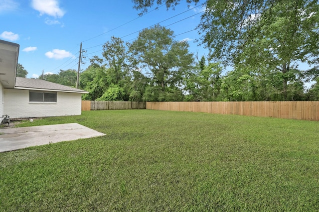 view of yard featuring a fenced backyard and a patio area