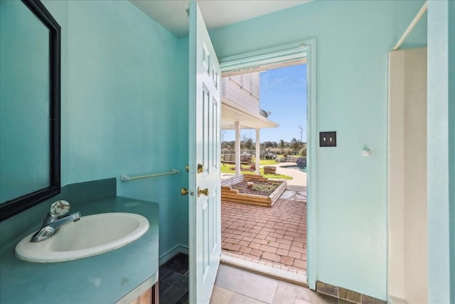 3139 Fm 1406, Winnie, TX 77665 - bathroom with baseboards and a sink