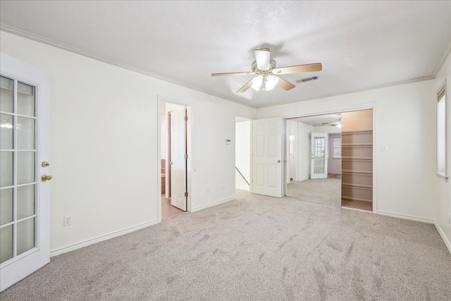 3139 Fm 1406, Winnie, TX 77665 - unfurnished bedroom featuring carpet flooring, ceiling fan, ensuite bath, baseboards, and a closet