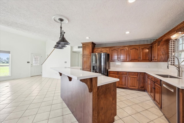 3139 Fm 1406, Winnie, TX 77665 - kitchen with a sink, appliances with stainless steel finishes, light tile patterned floors, and light countertops
