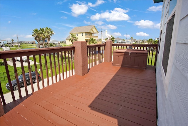 wooden deck with a residential view