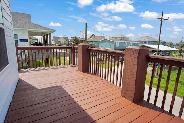 wooden deck with a residential view