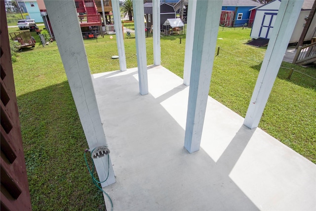 view of patio / terrace with a storage unit and an outbuilding