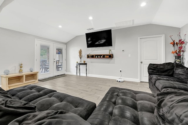 living area with visible vents, french doors, recessed lighting, and lofted ceiling