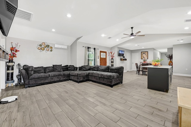 living room with a ceiling fan, vaulted ceiling, recessed lighting, and light wood-style flooring