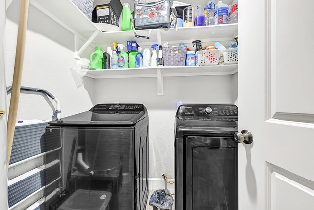 clothes washing area with laundry area and washing machine and dryer