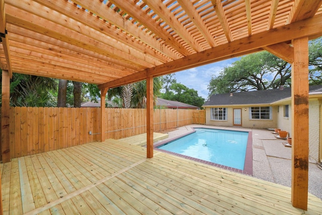 view of pool with a fenced backyard, a fenced in pool, and a wooden deck
