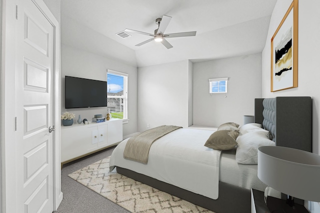 carpeted bedroom featuring visible vents and ceiling fan