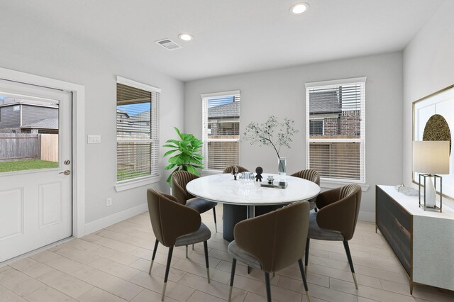 dining area featuring visible vents, recessed lighting, baseboards, and a wealth of natural light
