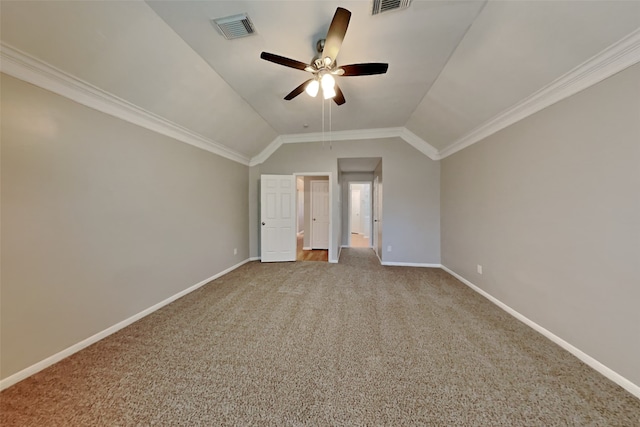 unfurnished bedroom featuring carpet floors, baseboards, vaulted ceiling, and visible vents