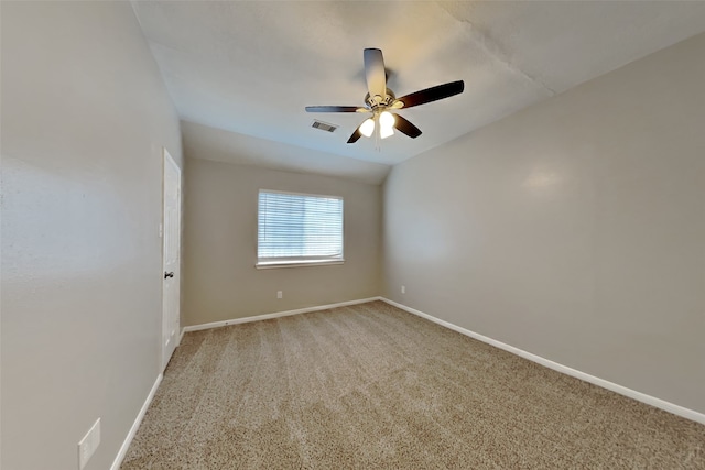 unfurnished room with visible vents, a ceiling fan, baseboards, and light carpet