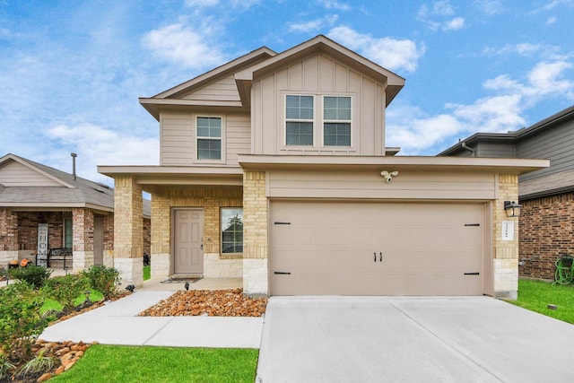 22619 Goose Pasture Ln, Spring, TX 77373 - view of front of home featuring board and batten siding, stone siding, and concrete driveway