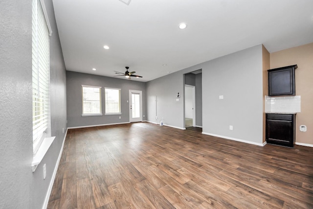 22619 Goose Pasture Ln, Spring, TX 77373 - unfurnished living room featuring dark wood-type flooring, a ceiling fan, and recessed lighting