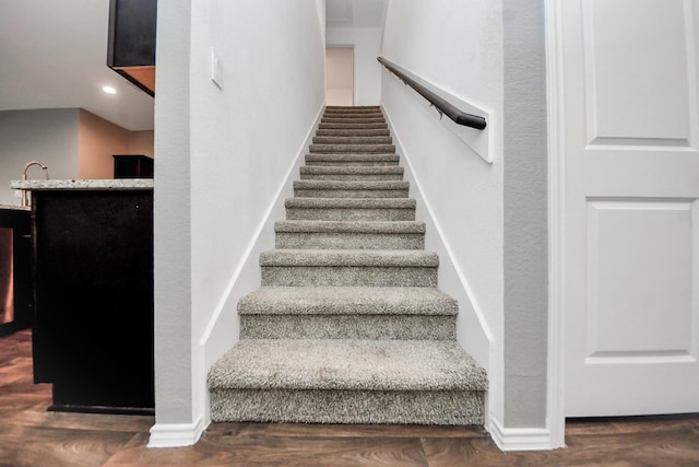 22619 Goose Pasture Ln, Spring, TX 77373 - stairway with wood finished floors and baseboards