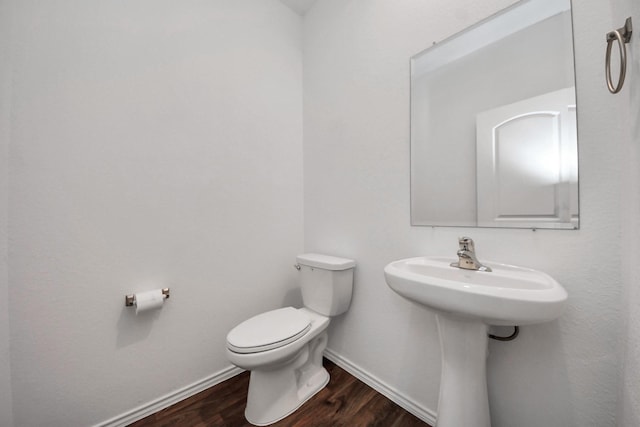 22619 Goose Pasture Ln, Spring, TX 77373 - half bath with toilet and wood finished floors