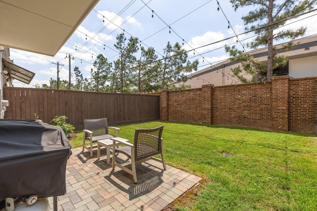 view of yard featuring a patio and fence