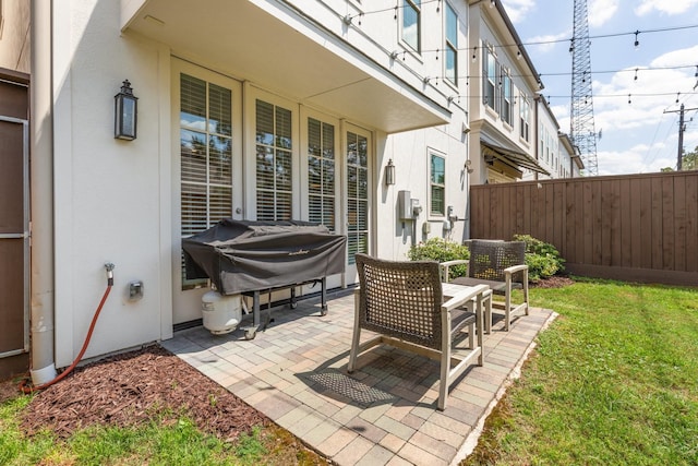 view of patio with fence and grilling area