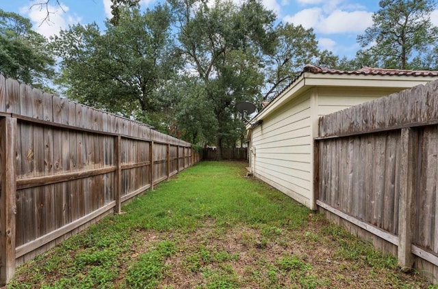 view of yard with a fenced backyard