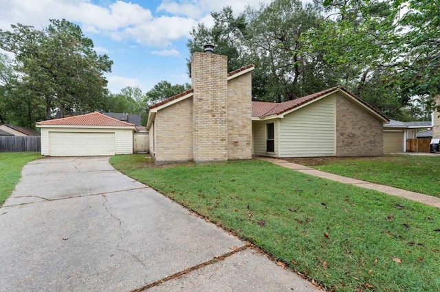 view of front of house with fence, a chimney, and a front yard