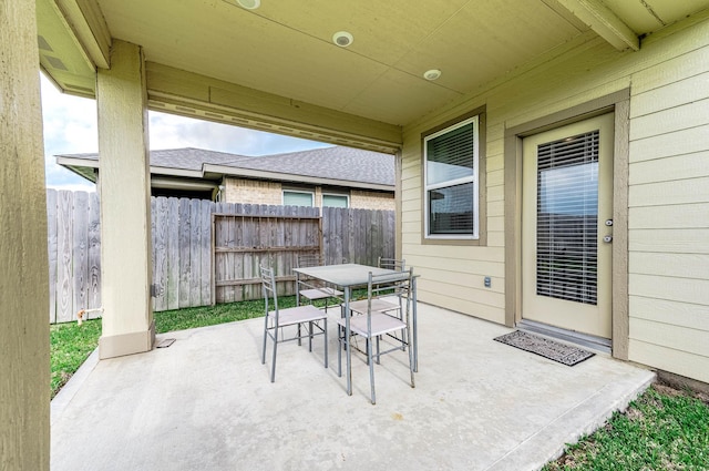 view of patio / terrace with outdoor dining area and fence