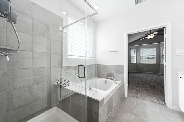 bathroom featuring tile patterned flooring, a ceiling fan, a shower stall, and a bath