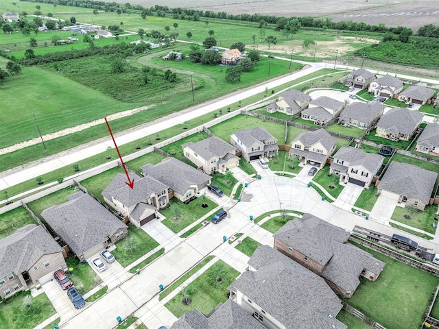 birds eye view of property with a residential view and a rural view