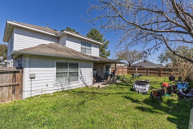 2103 Laurel Arbor Dr, Houston, TX 77014 - back of house featuring an outdoor fire pit, a fenced backyard, a patio, and roof with shingles