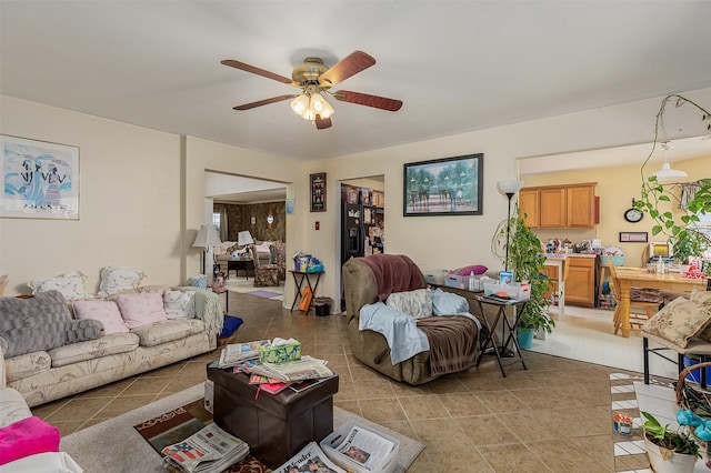 living area featuring a ceiling fan and light tile patterned floors