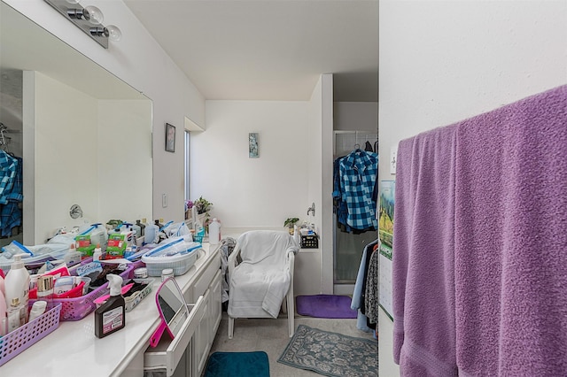 full bathroom with vanity and a stall shower