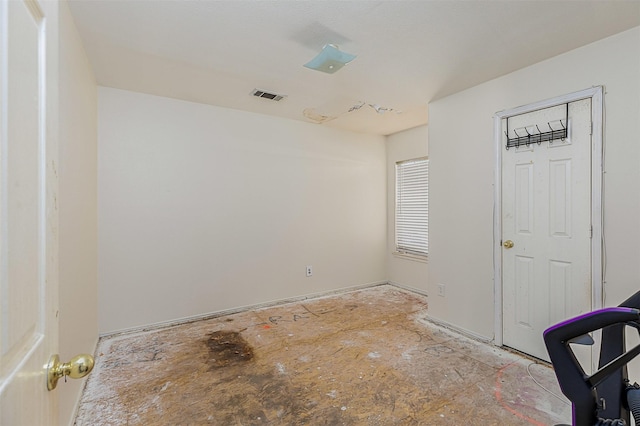 unfurnished room with visible vents